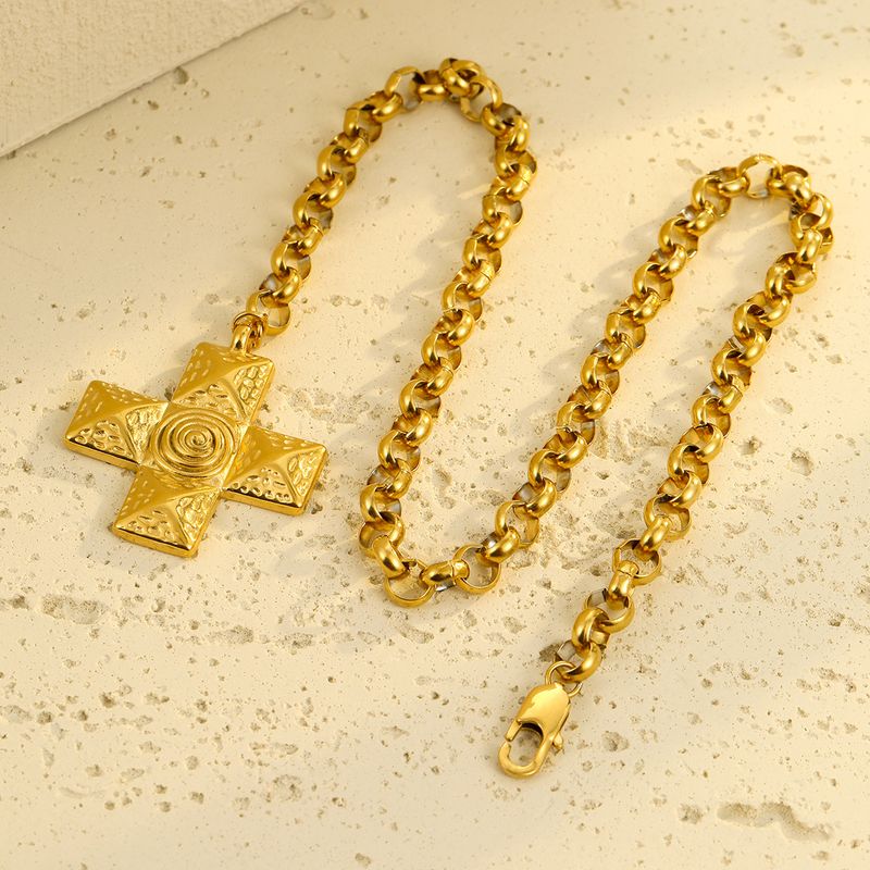 Collier INS polyvalent haut de gamme en acier inoxydable, métal titane, texture spirale et croix. Bijou_voghion.com