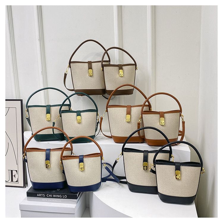 2024 nieuwe tas dames trendy en modieuze draagbare emmertas met klein ontwerp contrasterende kleur splitsen enkele schouder crossbody tas_voghion.com