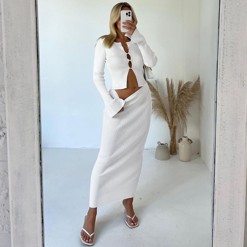 Abbigliamento donna autunno e inverno 2024 nuova moda cardigan bottoni ombelico esposto top gonna slim fit set all'ingrosso_voghion.com