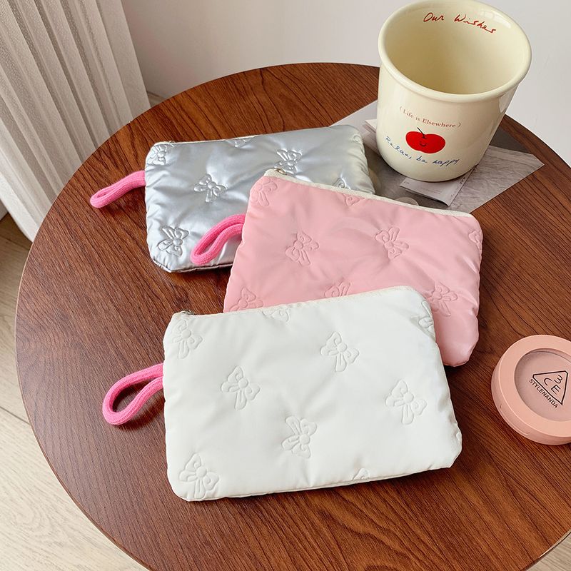 Borsa portamonete piccola portatile con fiocco in argento lucido per trucco, auricolari, cavi dati_voghion.com