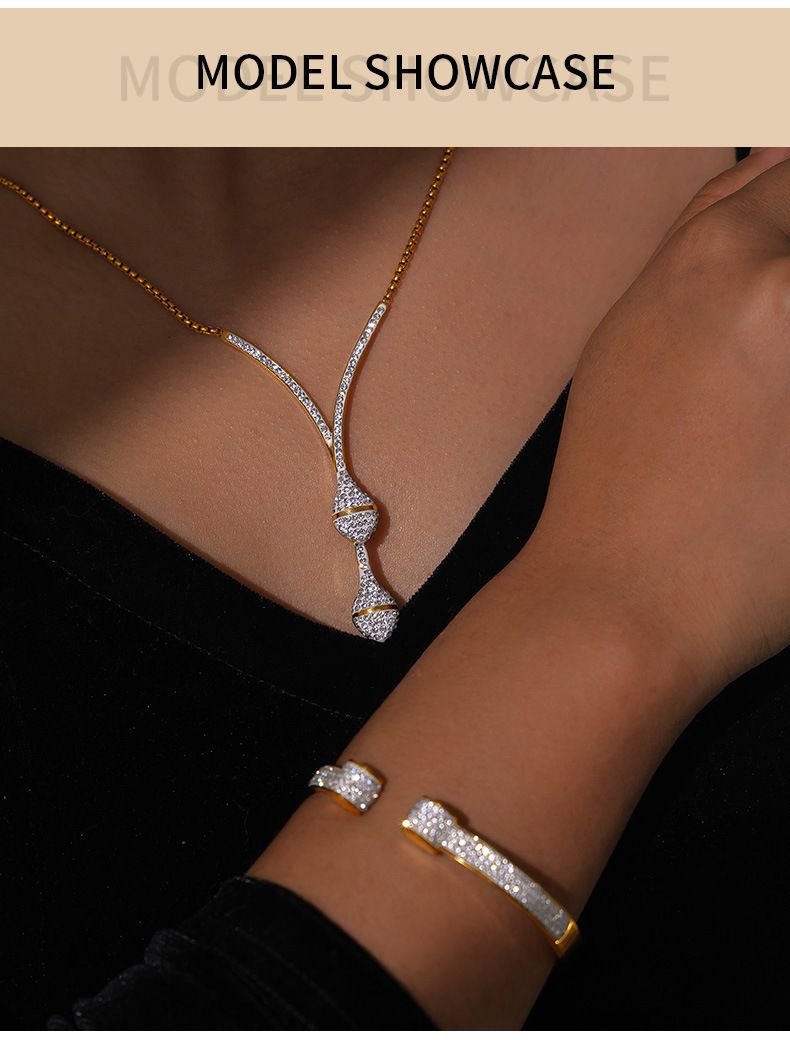 Luxe gelaagde ketting en armbandset voor dames met strass-steentjes, verguld titaniumstaal, elegante en stijlvolle slangenbotkettingset_voghion.com