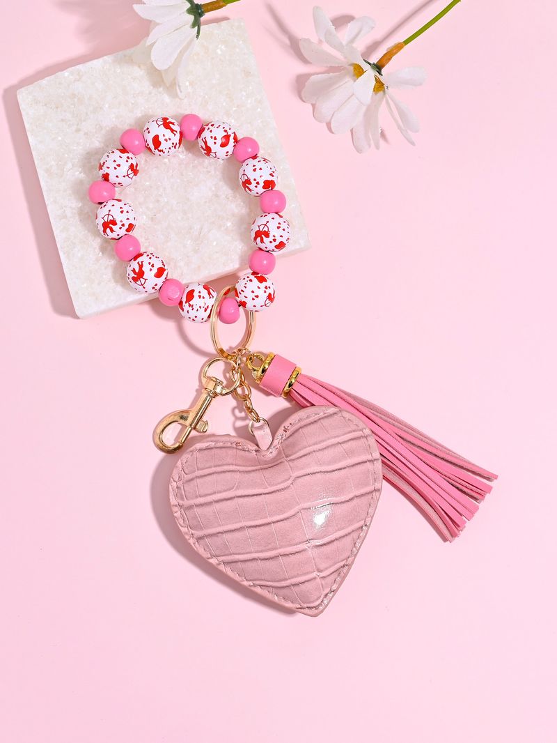 Portachiavi con braccialetto di perline di legno color leopardo, portachiavi con nappa a forma di cuore in pelle alla moda_voghion.com