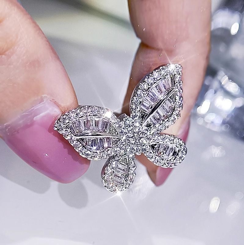 Set di gioielli da sposa con collana, orecchini e farfalla in platino e zirconi in streaming live_voghion.com