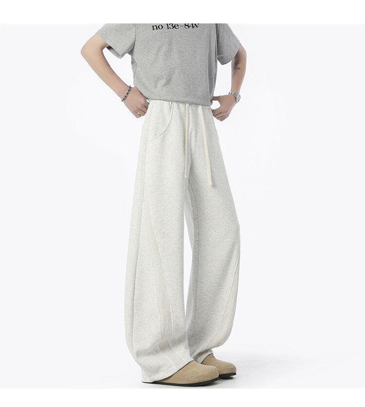 Jogginghose im dekonstruierten, einfarbigen Herrenstil – Cleanfit, lockere, gerade geschnittene Freizeit-Sweathose für Streetwear und den Alltag_voghion.com