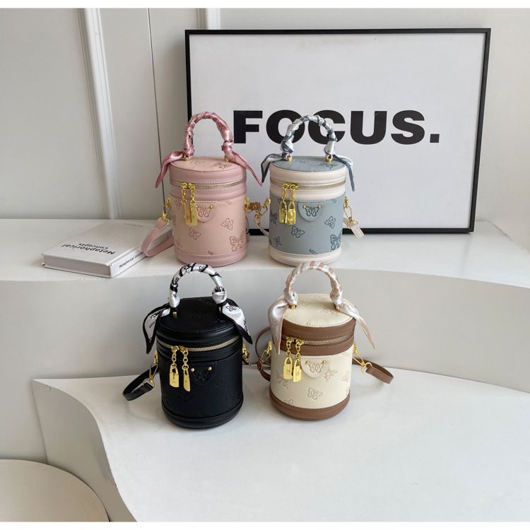 Borsa da donna retrò con motivo a farfalla, borsa a secchiello con colori a contrasto, borsa cilindrica da donna, borsa a tracolla con texture alla moda, design di nicchia_voghion.com