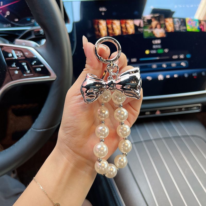 Versione coreana, ciondolo con perline di alta qualità, design di nicchia in oro e argento, papillon, accessori per borse, portachiavi per auto, decorazione_voghion.com
