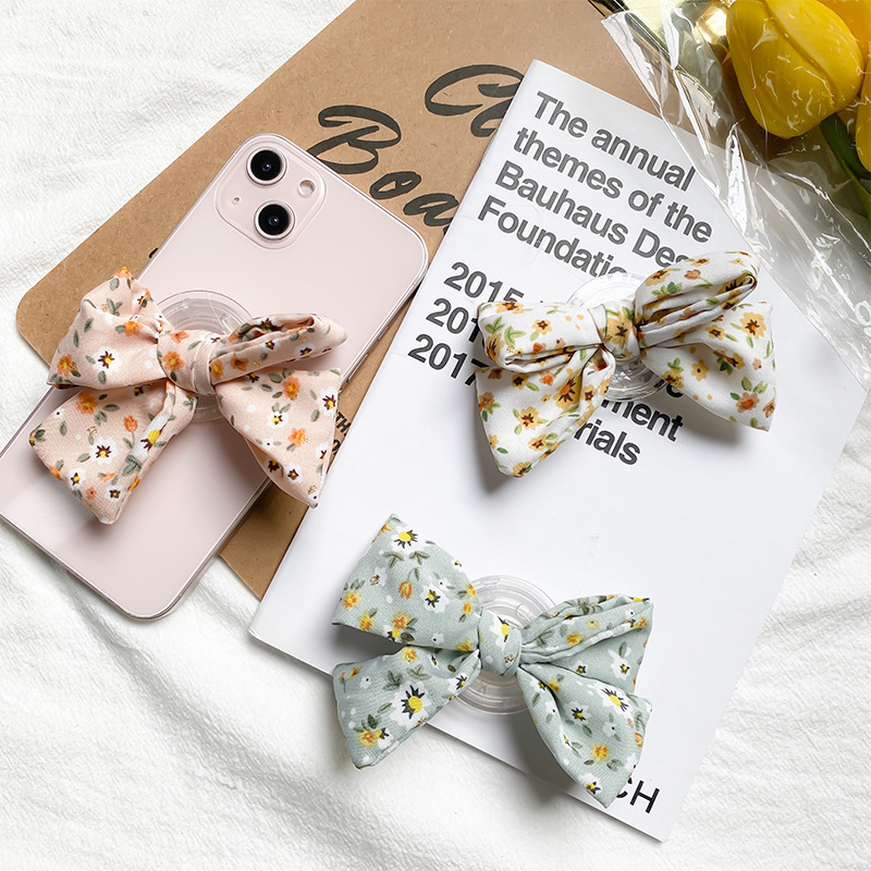 Piccolo fiocco fresco per cellulare coreano Instagram vento airbag posteriore adesivo pieghevole supporto da tavolo portatile_voghion.com