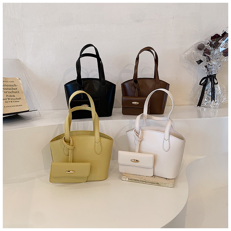 Borsa piccola portatile di moda estiva nuova borsa a secchiello casual semplice da donna 2023 borsa per ascelle suocera con trama di nicchia_voghion.com