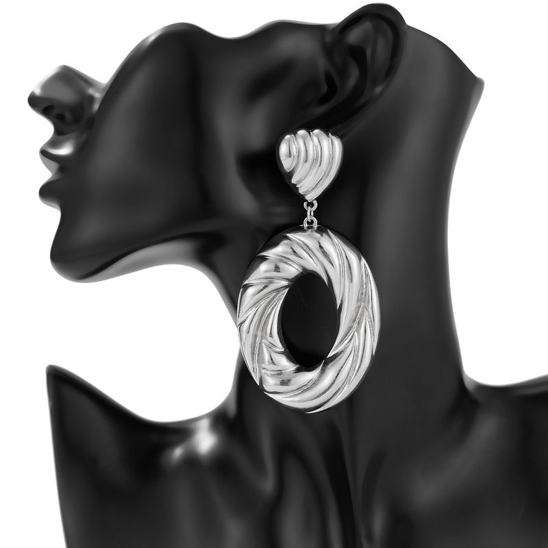 Personality metal geometric texture hollow earrings female irregular twisted glossy earrings earrings_voghion.com