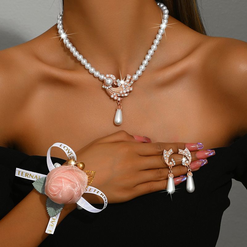Set di gioielli da donna alla moda, collana di perle, orecchini, bracciale, set di fiori in lega, abito da sposa, personalità, temperamento alla moda femminile_voghion.com