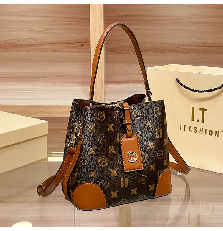 Borsa a secchiello retrò da donna: elegante borsa a tracolla e a spalla con doppio scomparto, design stampato, materiale in PVC morbido_voghion.com