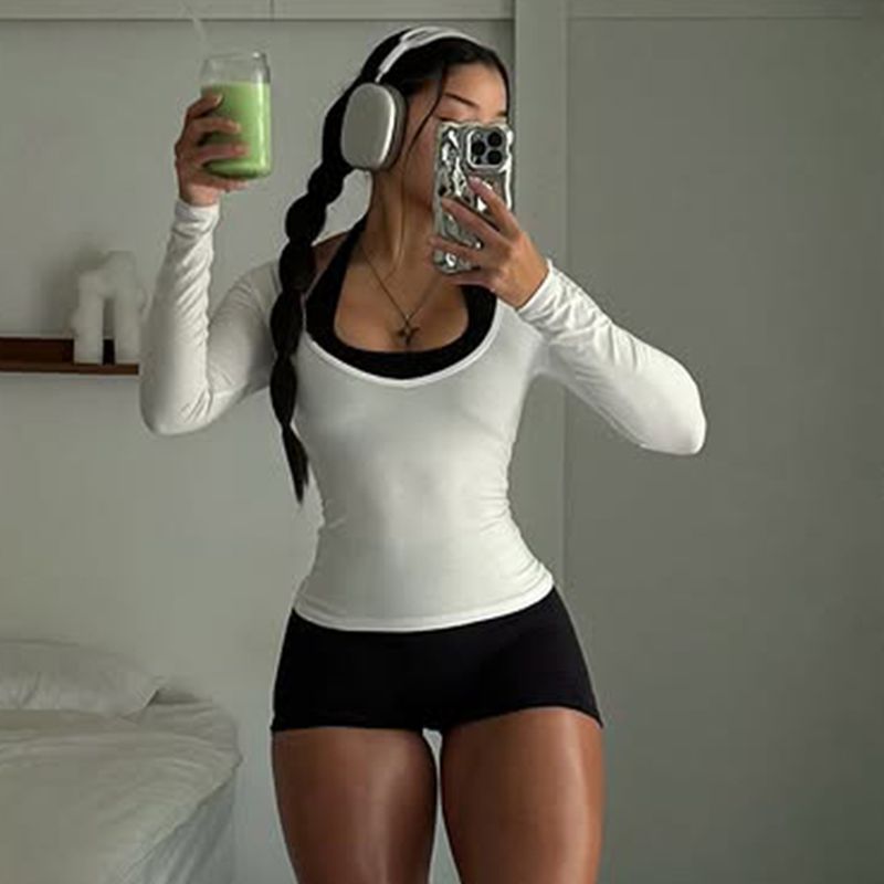 Grenzüberschreitender europäischer und amerikanischer Sport-Look: Zweiteiliger Lagenlook mit Neckholder, eng anliegendem Jumpsuit und U-Ausschnitt._voghion.com