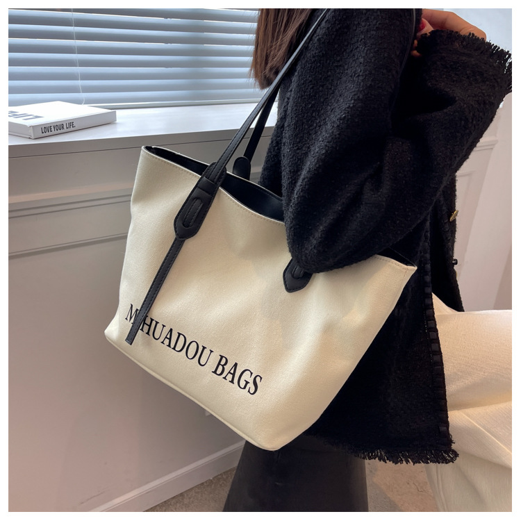 Canvas Große Damen 2023 Neue Mode Pendler Umhängetasche Einfarbig Brief Stil Urban Einfache Einkaufstasche_voghion.com
