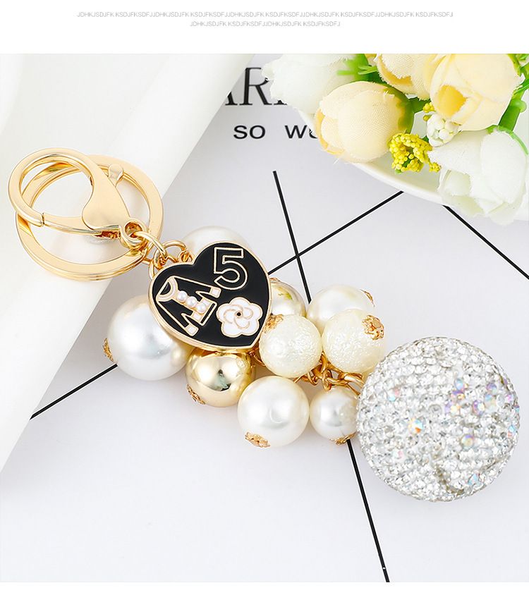 Exquisite diamond studded round pearl string small fragrance keychain clothes 5-character metal decoration bag pendant_voghion.com
