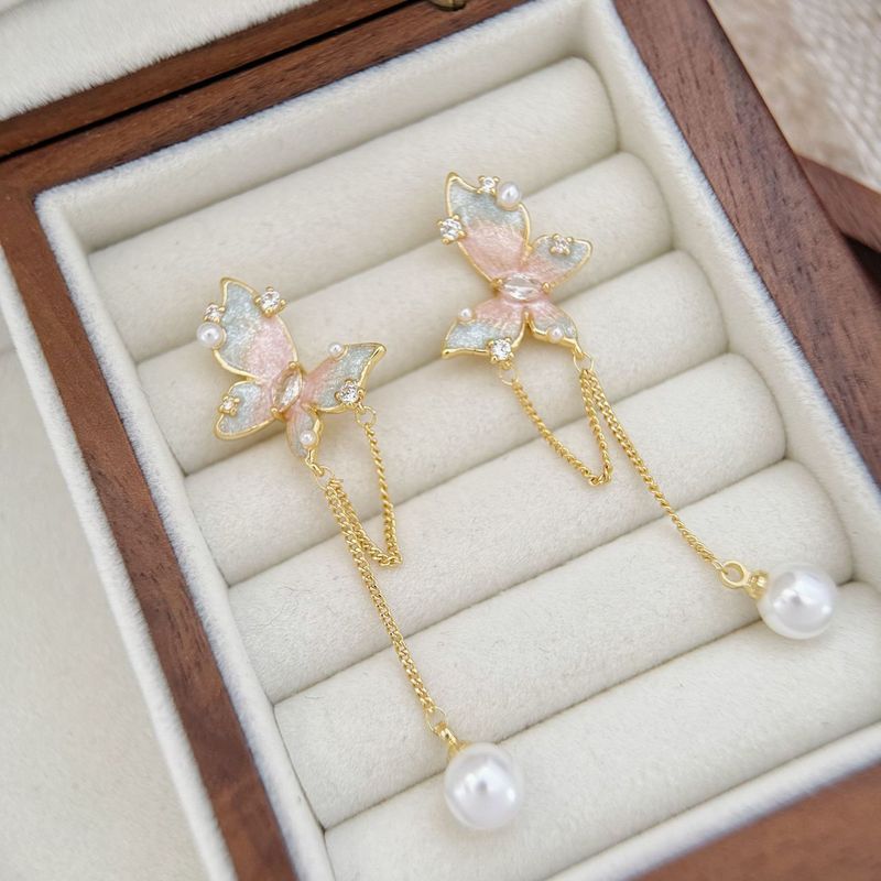 Orecchini di perle squisite coreane con nappa lunga e farfalla, di lusso leggero e di alta qualità, da donna_voghion.com