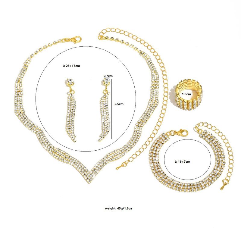 Set di gioielli da sposa con collana, orecchini, bracciale e anello, quattro pezzi, catena con griffe e strass_voghion.com