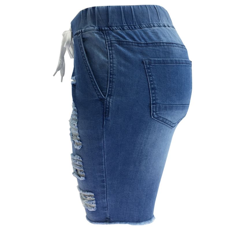 Jeans corti blu lavaggio medio elasticizzati a vita media strappati da donna_voghion.com