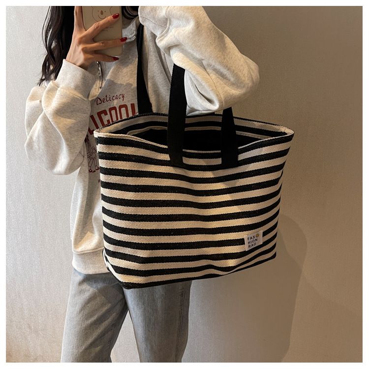 2024 New Spring/summer Popular Simple Shoulder Bag Commuter Handheld Canvas Tote Bag Casual Large Capacity Bag for Women_voghion.com