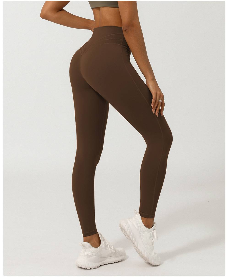 Women's Nude Cross V-shaped Nine Point Yoga Pants Without T-line Peach Hip Lifting Quick Drying Sports Pants_voghion.com