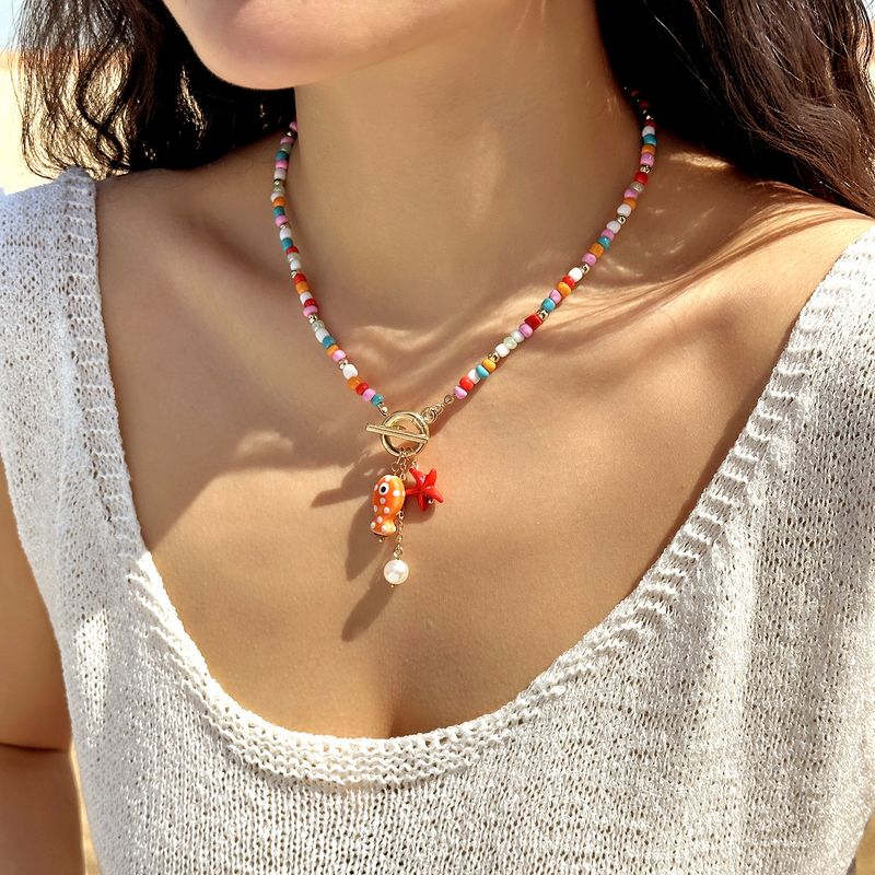 Nouveau collier double rang de perles de riz, pompon en céramique et fermoir OT, orné de petits poissons et d'étoiles de mer._voghion.com