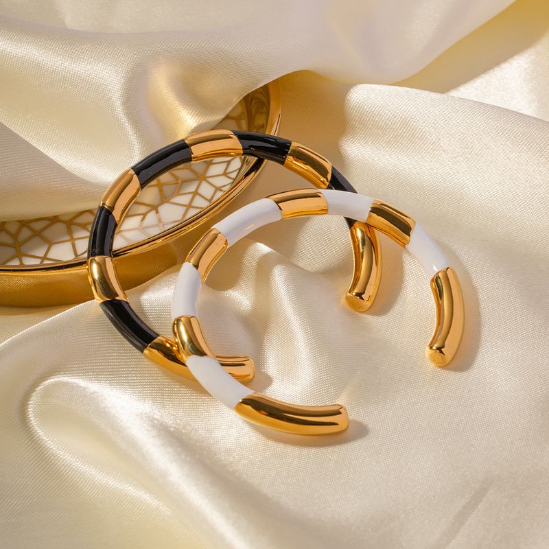Luxe léger, tempérament, acier titane avec un design d'ouverture de niche, bracelet d'huile goutte à goutte en or noir et blanc haut de gamme_voghion.com