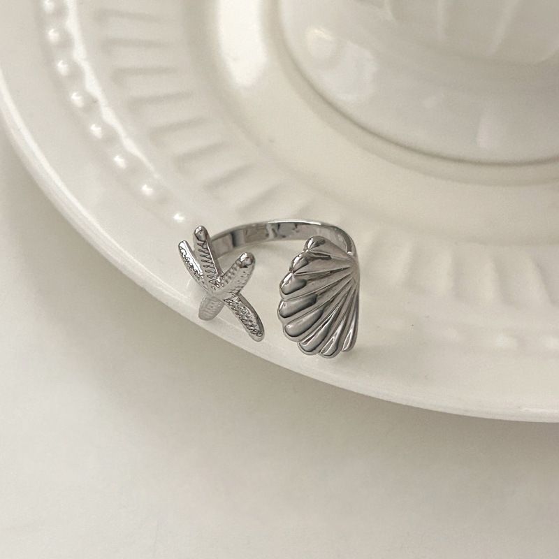 Anello aperto da donna con design a conchiglia di stella marina alla moda, adatto per viaggi in spiaggia_voghion.com
