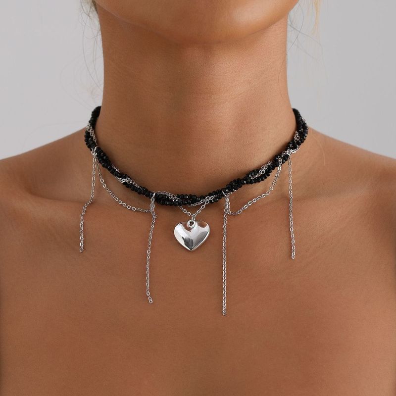 Collana da donna con ciondolo a forma di cuore con nappa, catena per clavicola con perline irregolari, design metallico alla moda_voghion.com