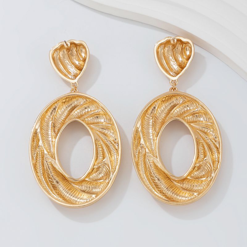 Personality metal geometric texture hollow earrings female irregular twisted glossy earrings earrings_voghion.com