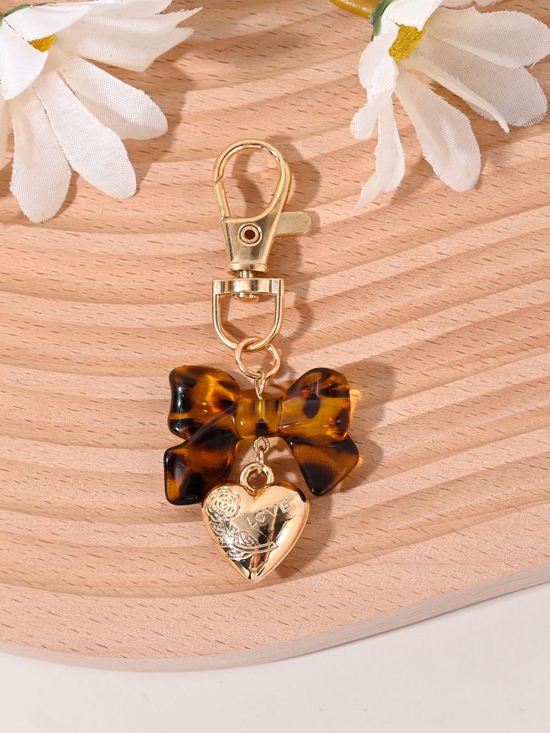 Porte-clés avec pompon et nœud papillon imprimé léopard, nouvelle mode, mignon, pendentif pour sac_voghion.com