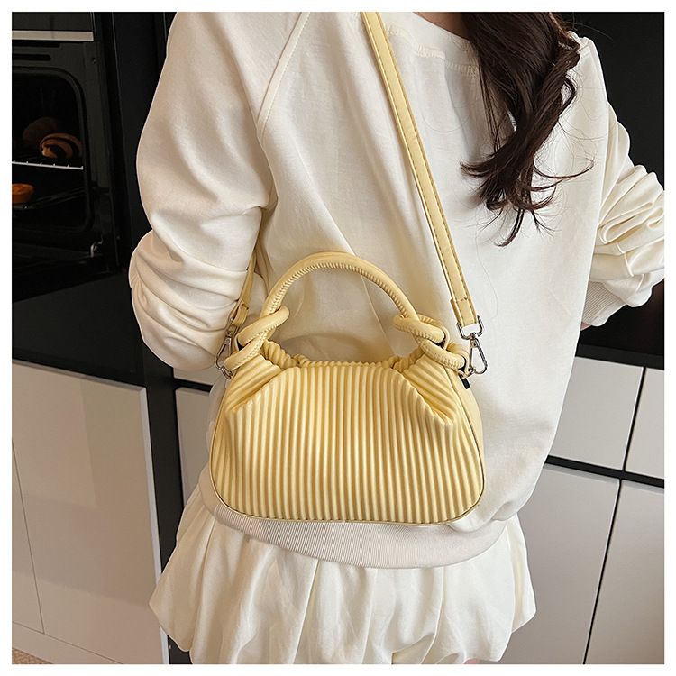 Borsa a mano a righe plissettata con personalità di nicchia per donna, borsa a secchiello versatile alla moda 2025, borsa a tracolla semplice estiva_voghion.com
