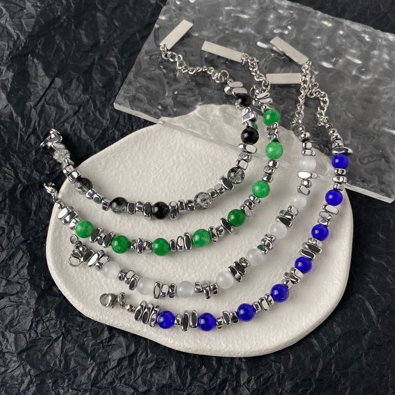 Den senaste omgången av designade kattögonstensarmband skarvade med INS trendiga handtillbehör titanstål obsidian herr- och damarmband_voghion.com