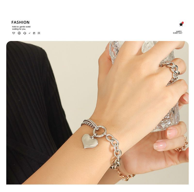 Bracciale con catena cubana a forma di cuore, in acciaio al titanio placcato oro, stile europeo e americano, resistente allo sbiadimento._voghion.com