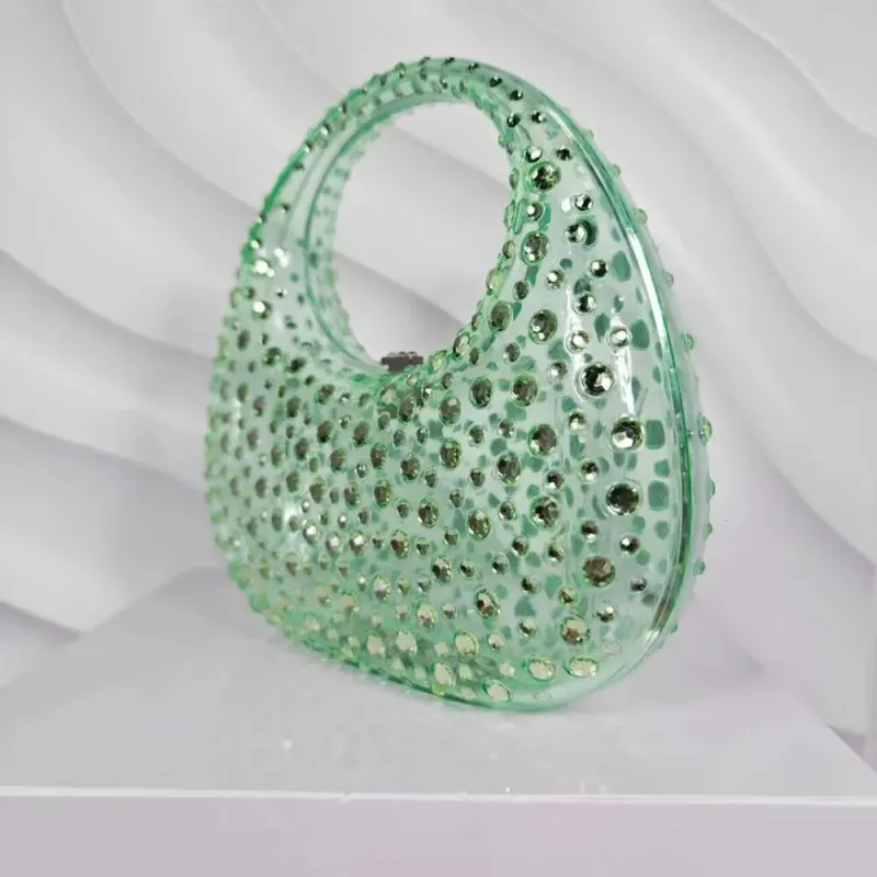 Borsa da sera da donna in acrilico trasparente lucido con motivo a mezzaluna tempestato di diamanti e strass_voghion.com