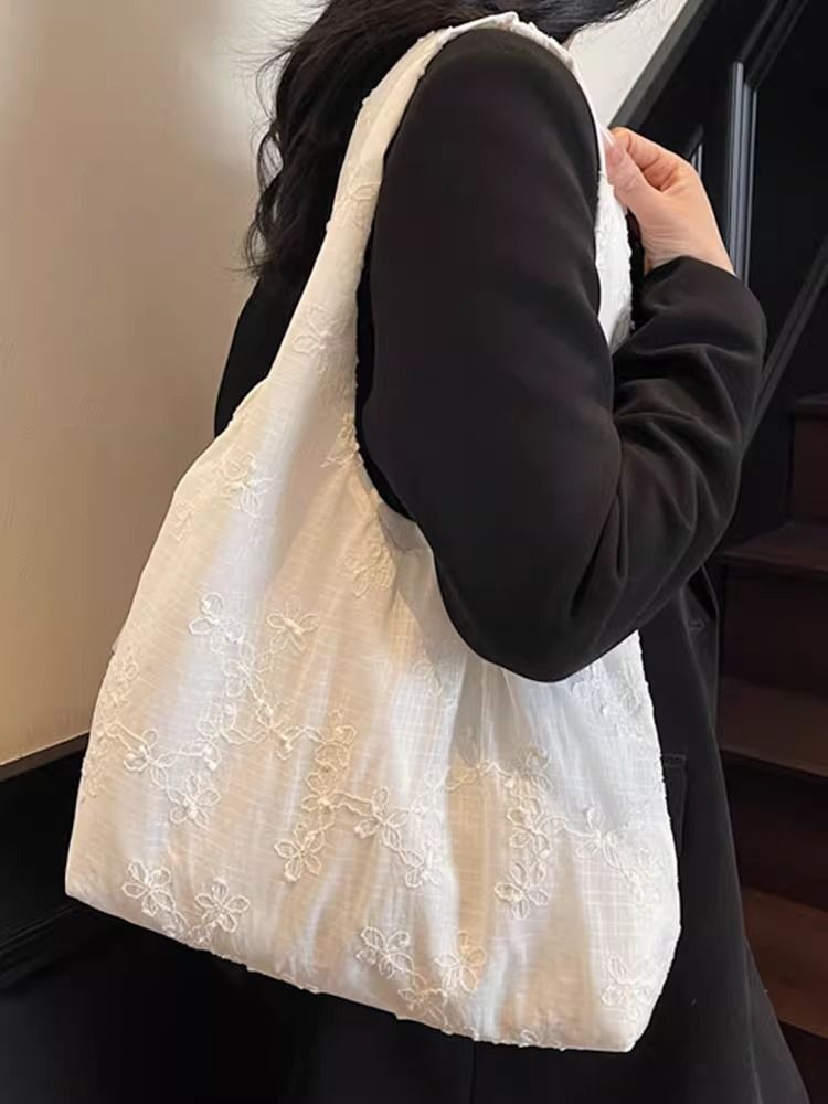 Borsa a tracolla grande e capiente in tela floreale autunno/inverno 2025, versatile e alla moda_voghion.com