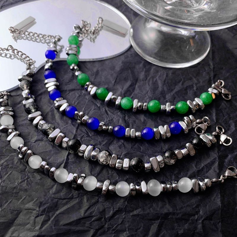Den senaste omgången av designade kattögonstensarmband skarvade med INS trendiga handtillbehör titanstål obsidian herr- och damarmband_voghion.com