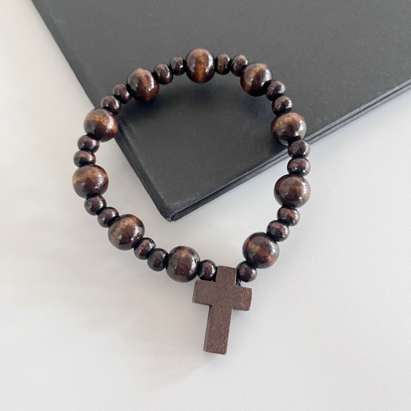 Bracelet élastique fait main en perles de bois noires et croix pour femmes et hommes_voghion.com