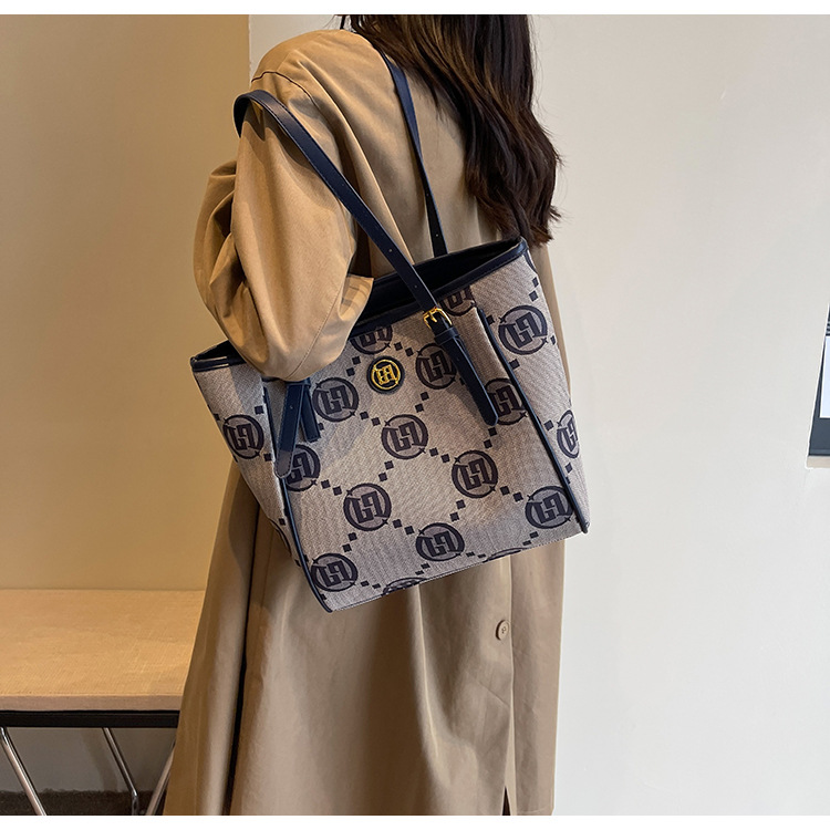 2023 Neue, heiß verkaufte Jacquard-Premium-Einkaufstasche für Damen mit großer Kapazität, ausgehende Handtasche, vielseitige, temperamentvolle Umhängetasche für Damen_voghion.com