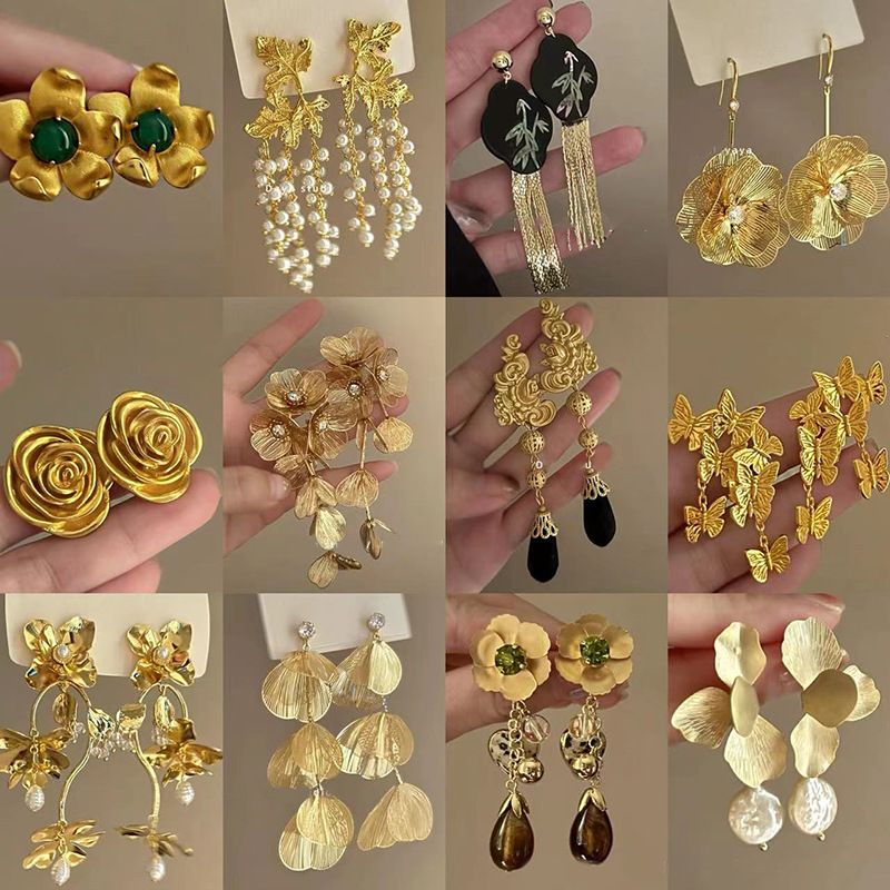 Nappa con fiore scavato con ago d'argento, alla moda, personalizzata, stile fresco e distaccato, lunga, elegante e di alta qualità._voghion.com