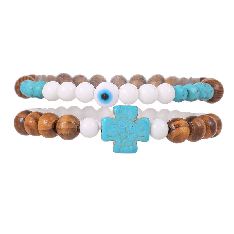 Handgefertigtes Herrenarmband mit türkisfarbenem Kreuz, Holzperlen, Porzellan-Jade-Perlen und trendiger Türkis-Verzierung._voghion.com