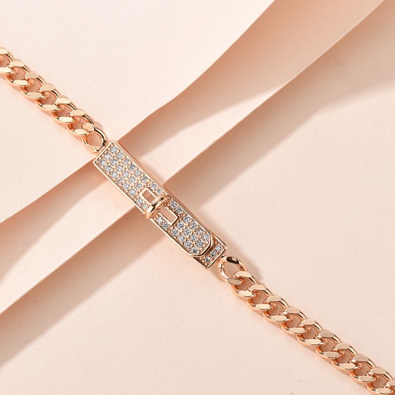Braccialetto di rame semplice, versatile, alla moda, in oro champagne, con catena cubana leggera e di lusso, con bottoni pieni di diamanti._voghion.com