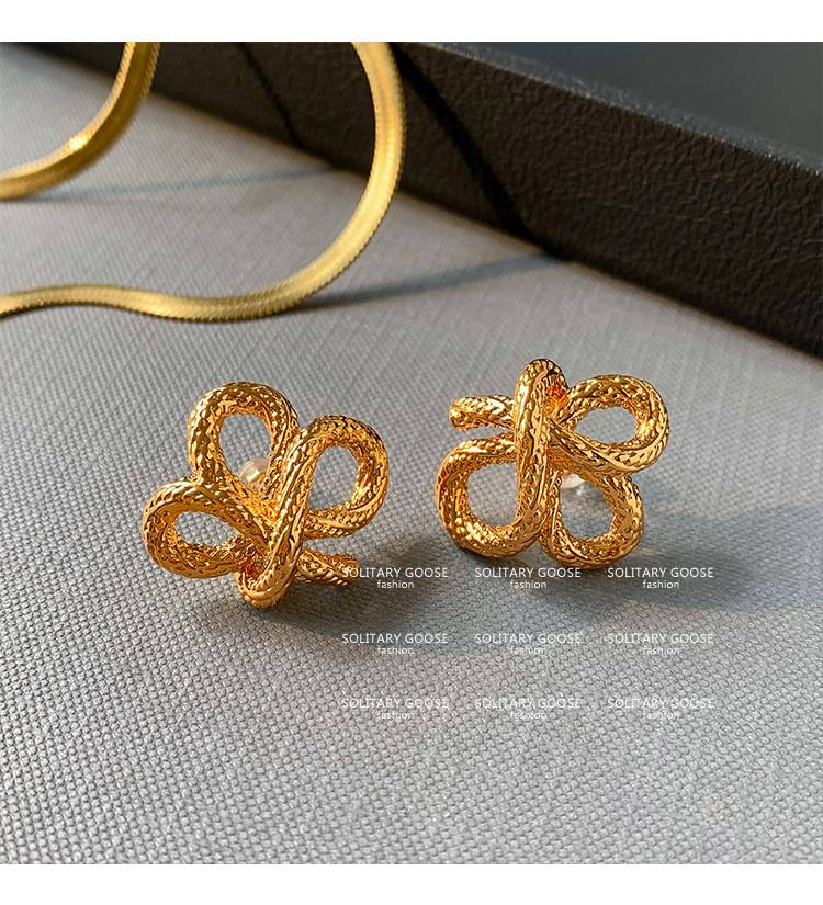 2024 new personality niche design earrings European and American French knotted twist gold earrings_voghion.com