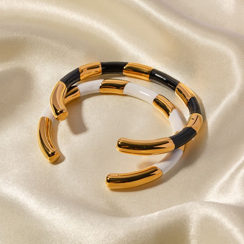 Luxe léger, tempérament, acier titane avec un design d'ouverture de niche, bracelet d'huile goutte à goutte en or noir et blanc haut de gamme_voghion.com