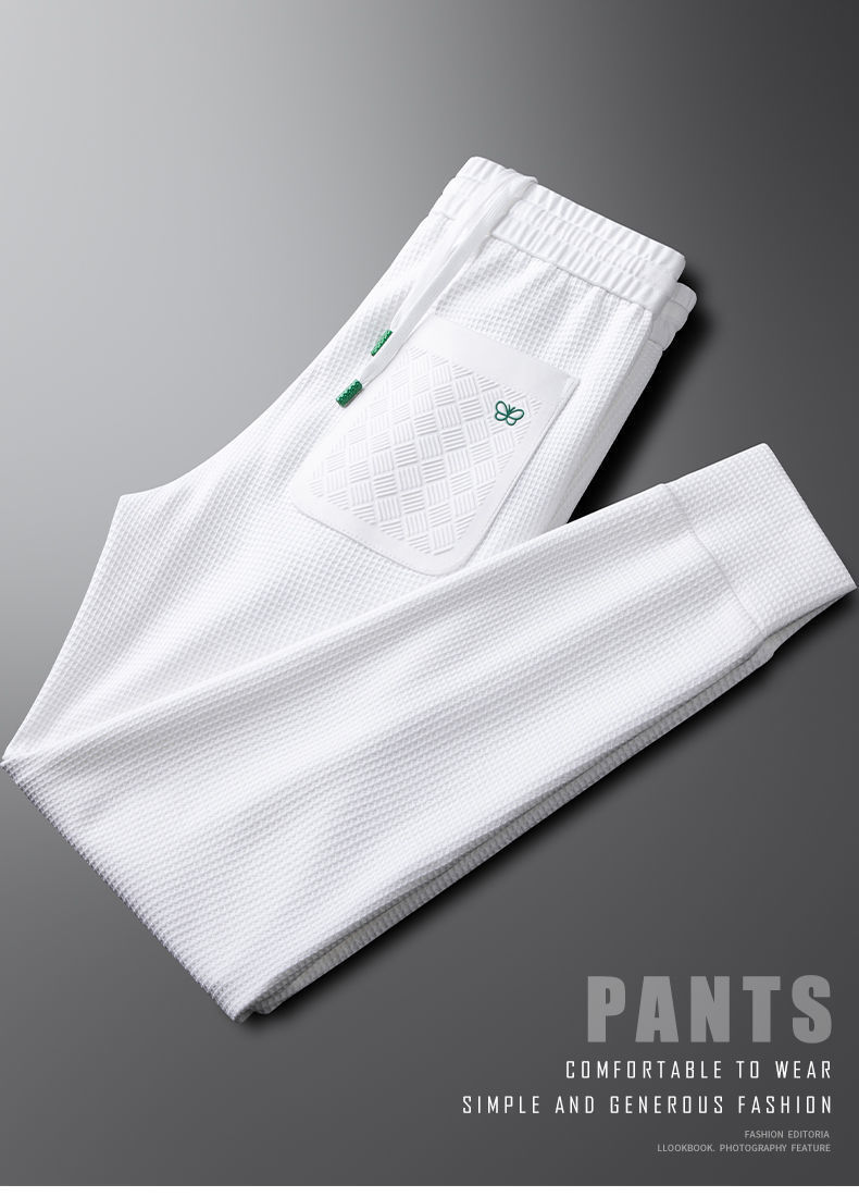 Pantaloni bianchi a quadri waffle leggeri di lusso alla moda europea per uomo, vestibilità slim e casual morbidi, primavera e autunno_voghion.com