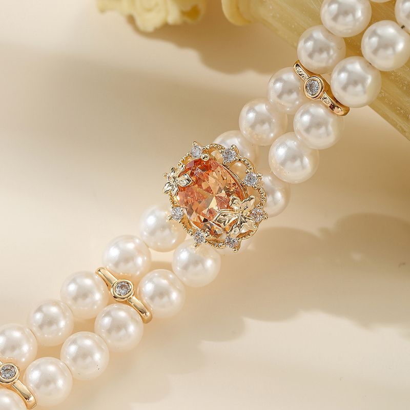 Buntes, mit Edelsteinen eingelegtes, mehrreihiges Perlenarmband in olivgrünem Zirkonia_voghion.com