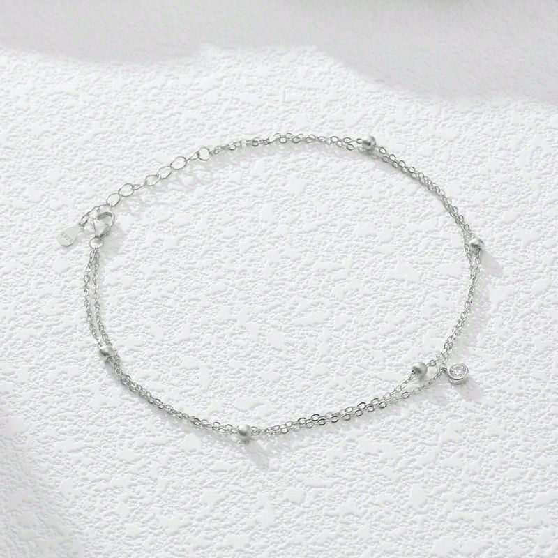 Un gioiello da caviglia per le donne, con ciondolo in zircone artificiale rotondo, minimalista, elegante, leggero e lussuoso, a doppio strato, in argento._voghion.com