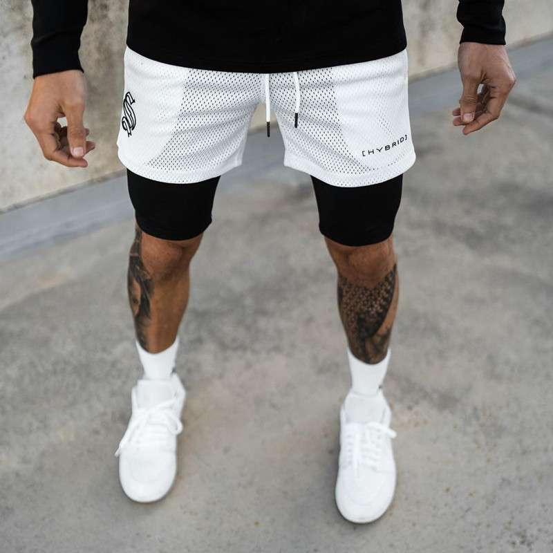Pantaloncini sportivi alla moda a doppio strato per l'allenamento da uomo falso in due pezzi da basket in esecuzione fitness capris_voghion.com