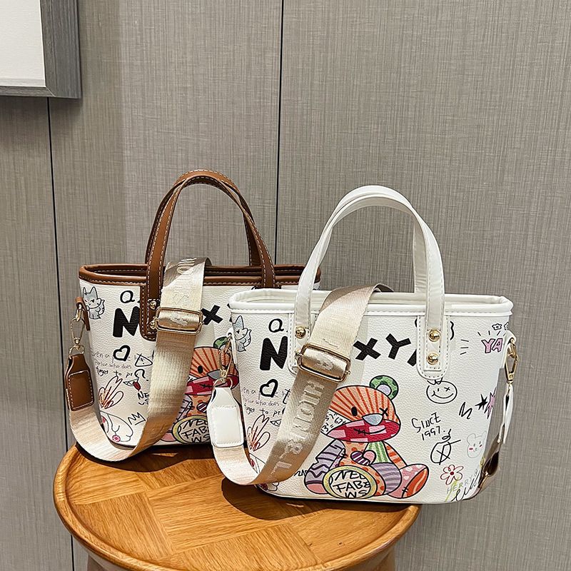 Borsa a secchiello portatile con simpatici graffiti dei cartoni animati per le donne, 2023, nuova moda, versatile, piccola, tracolla singola_voghion.com