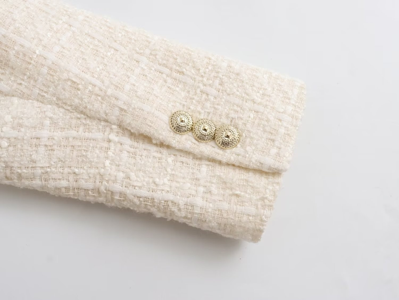 Damjacka med lös kostym med textur och mode_voghion.com