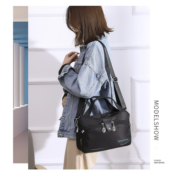 Modern och lätt Oxfordtyg Koreansk version Dam Casual Stor Kapacitet Vattentät Rese Shopping Handhållen Axelväska Crossbody_voghion.com