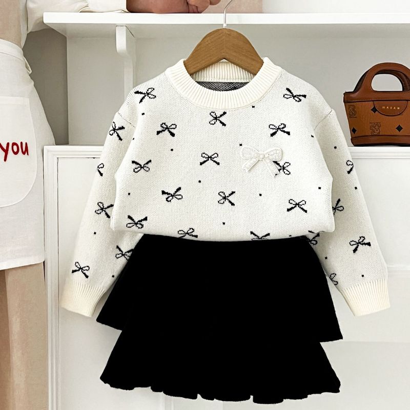 Gonna in maglia per ragazze 2025 Autunno e inverno, nuova gonna a torta con scollo rotondo e fiocco per ragazze, completo in due pezzi_voghion.com